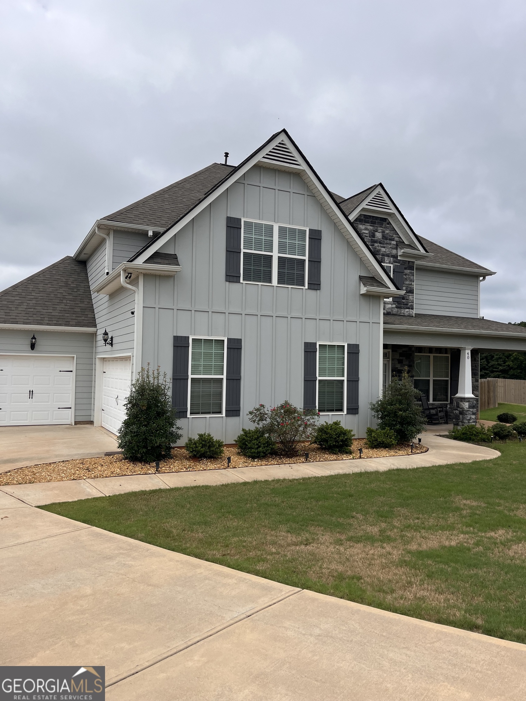 40 Owens Path Senoia, GA 30276 - Photo 19 of 21 a front view of a house with a yard