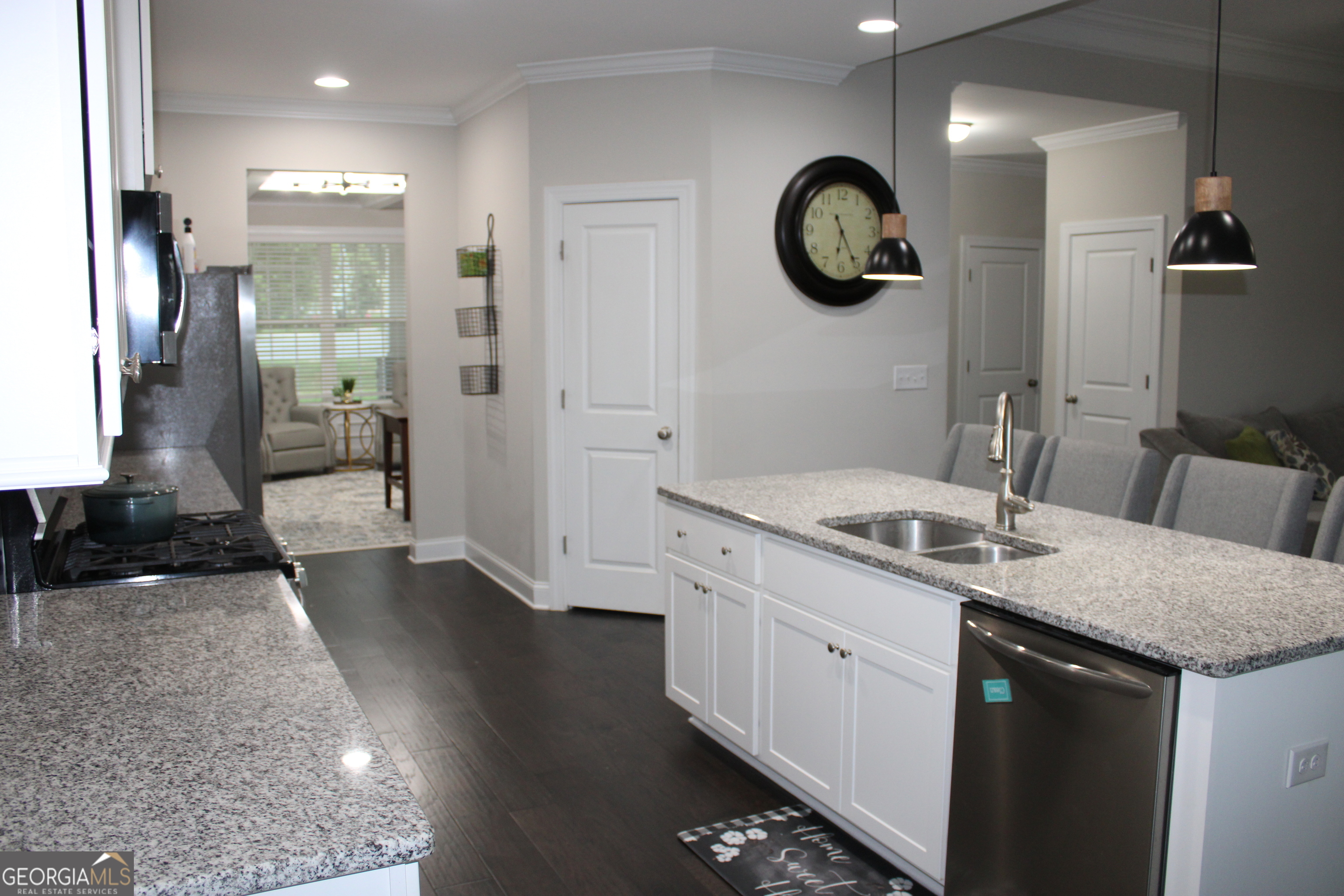 40 Owens Path Senoia, GA 30276 - Photo 6 of 21 a bathroom with a granite countertop sink a toilet a mirror and vanity