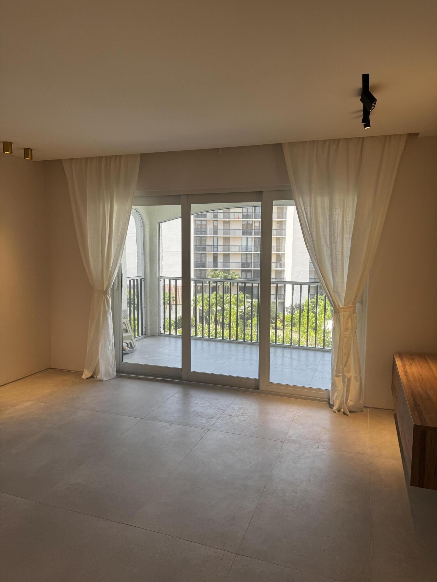 2871 North Ocean Boulevard, Unit R444 Boca Raton, FL 33431 - Photo 7 of 42 a view of empty room with floor to ceiling window