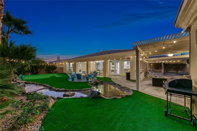a view of living room kitchen with furniture and outdoor space
