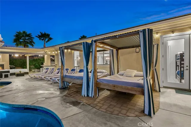 a living room with fireplace furniture and a window