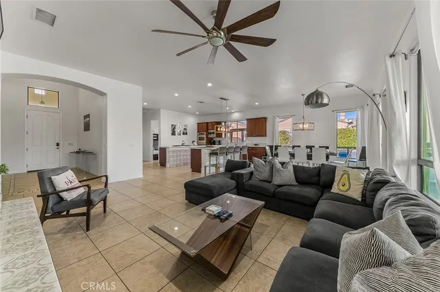 a view of a dining room with furniture wooden floor and a chandelier