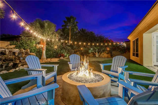 a view of a chairs and table in patio