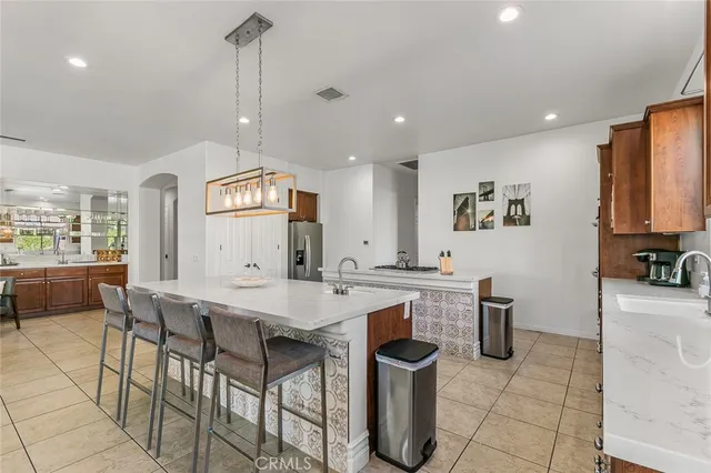 a bedroom with two beds and painting on the wall
