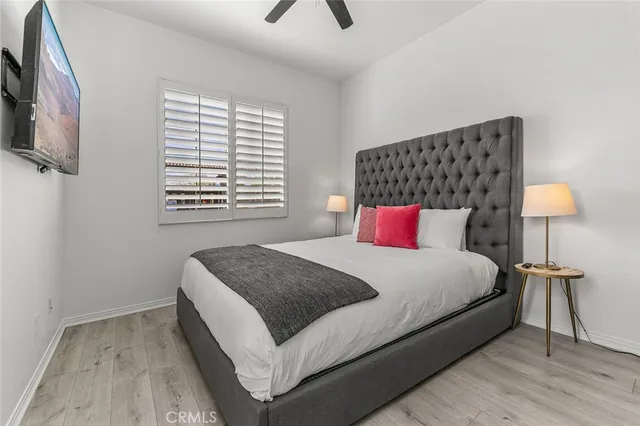 a bedroom with a bed and a couch