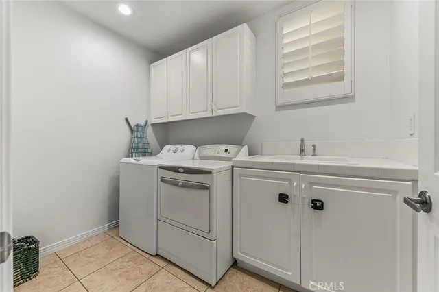 a view of a house with backyard sitting area and garden