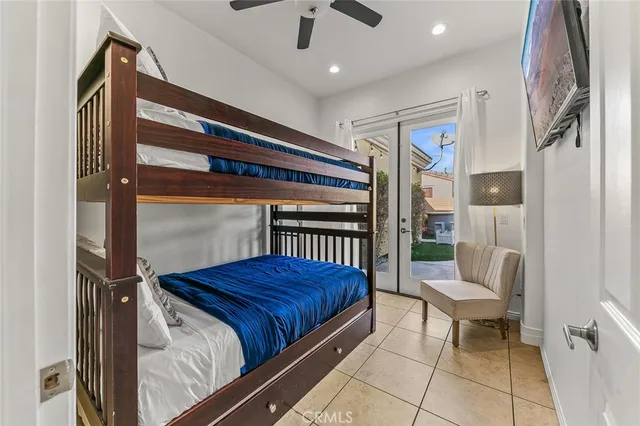 a view of a patio with table and chairs with wooden fence