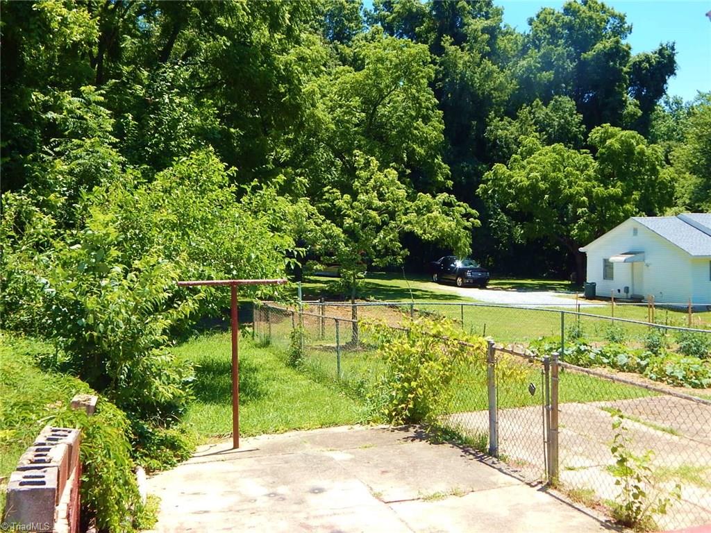 1304 Forrest Street High Point, NC 27262 - Photo 16 of 20 Partially fenced yard with patio.