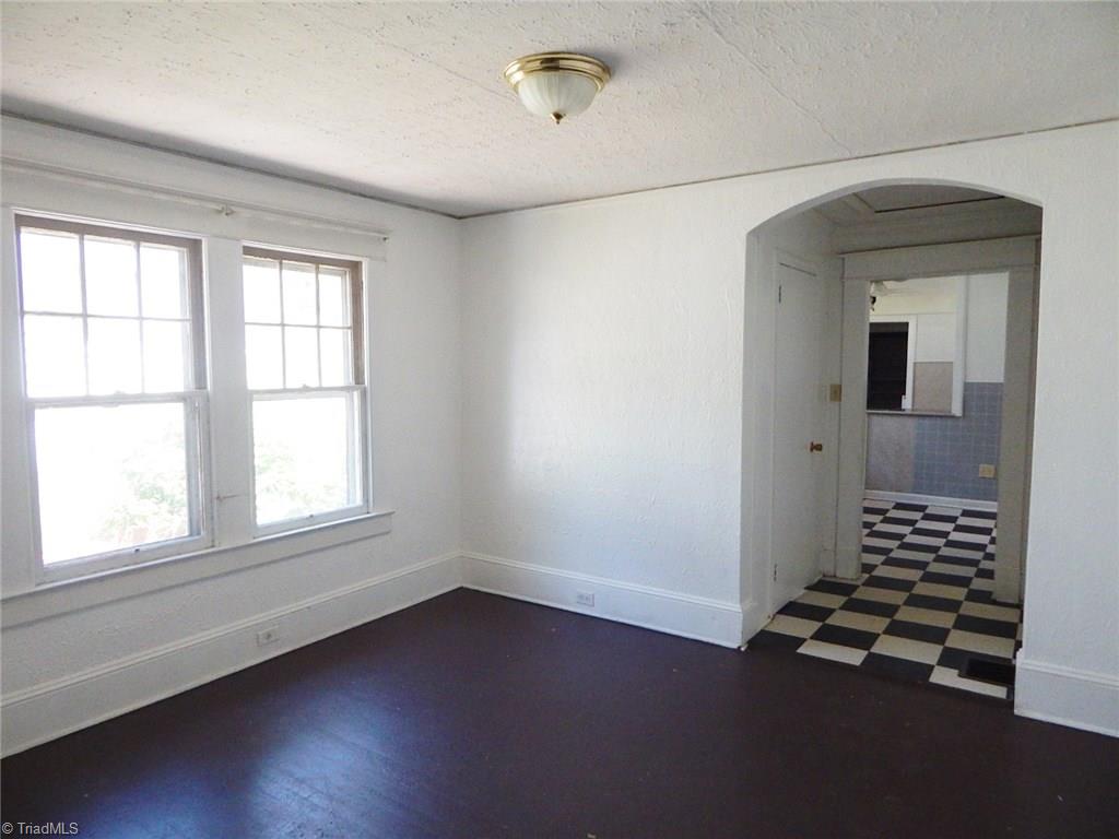 1304 Forrest Street High Point, NC 27262 - Photo 4 of 20 Den or potential dining room between living room and kitchen.