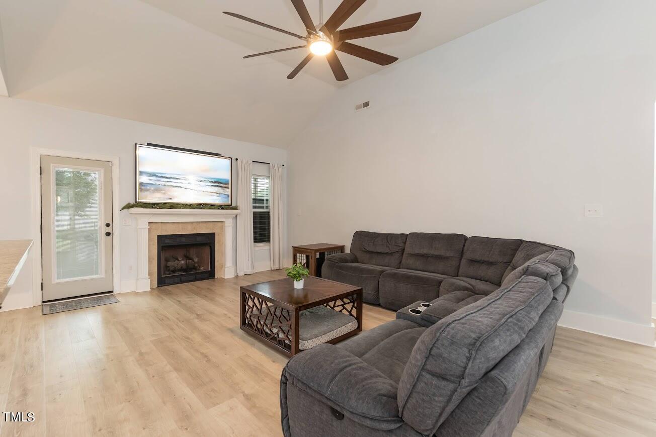 91 Colson Drive Garner, NC 27529 - Photo 12 of 46 a living room with furniture and a fireplace