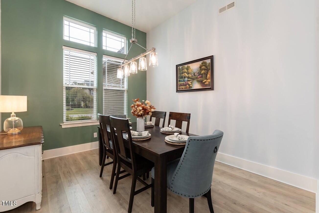 91 Colson Drive Garner, NC 27529 - Photo 14 of 46 a dining room with furniture and window