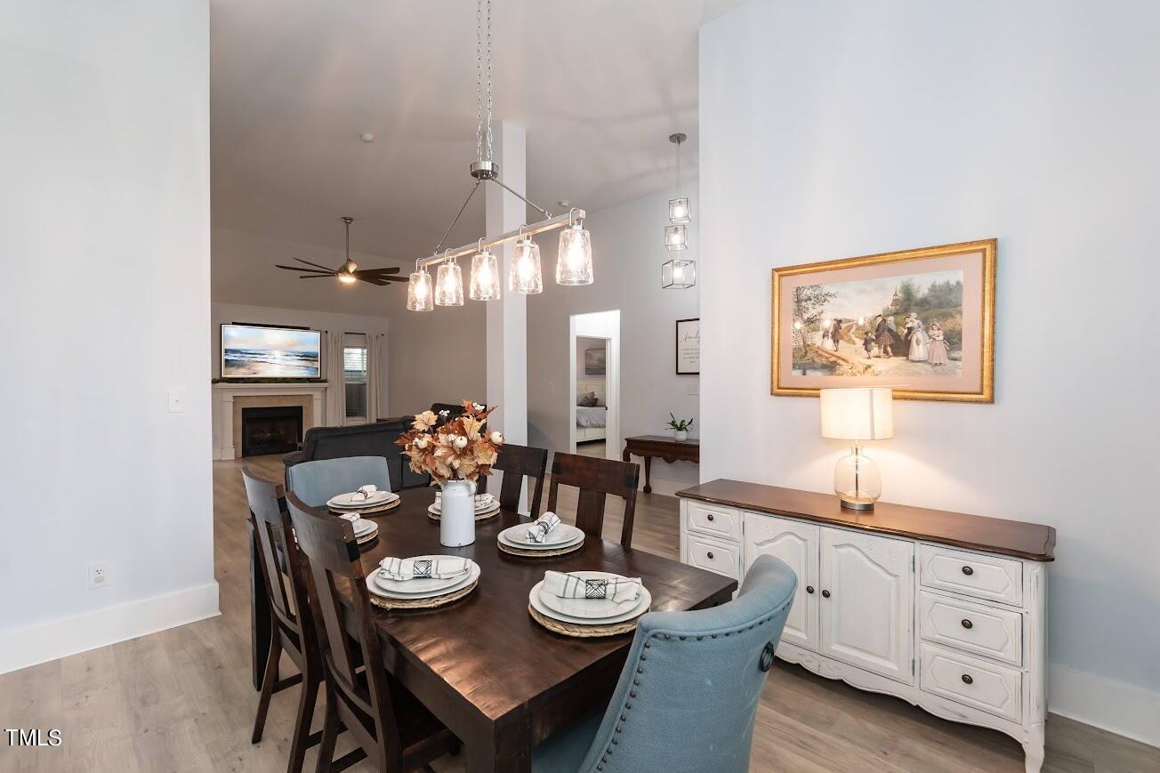 91 Colson Drive Garner, NC 27529 - Photo 15 of 46 a view of a dining room with furniture and chandelier