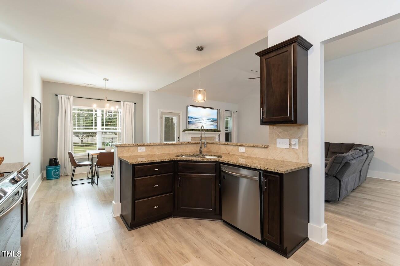91 Colson Drive Garner, NC 27529 - Photo 21 of 46 a kitchen with a sink and a stove top oven