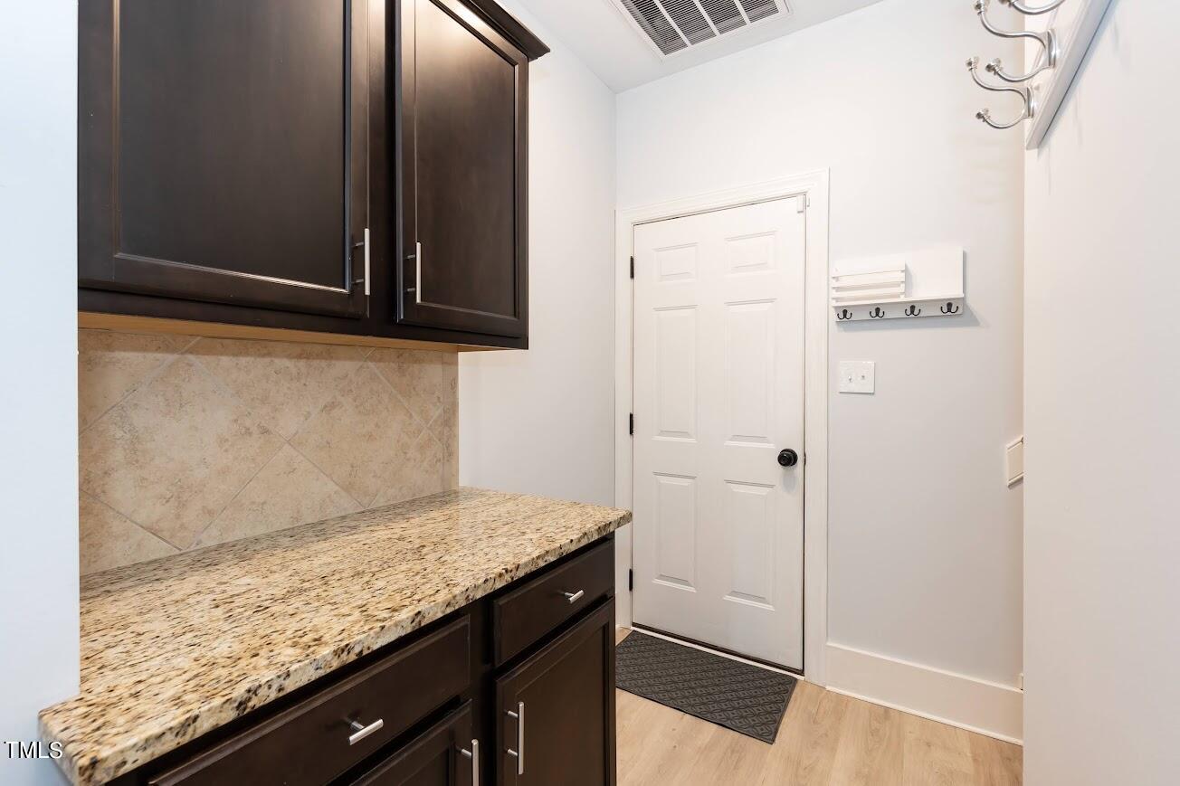 91 Colson Drive Garner, NC 27529 - Photo 23 of 46 a bathroom with a granite countertop sink and a mirror