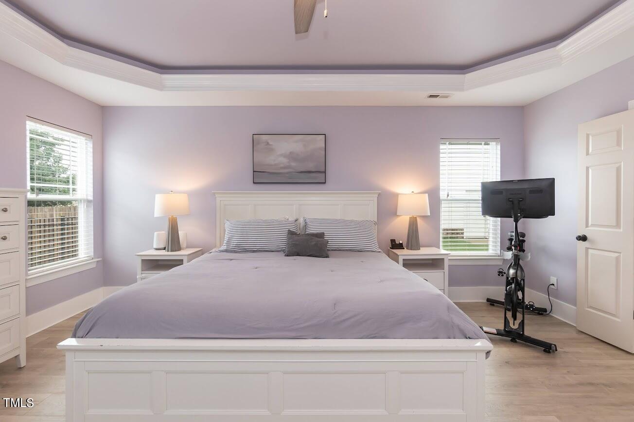 91 Colson Drive Garner, NC 27529 - Photo 25 of 46 a bedroom with a bed and a table