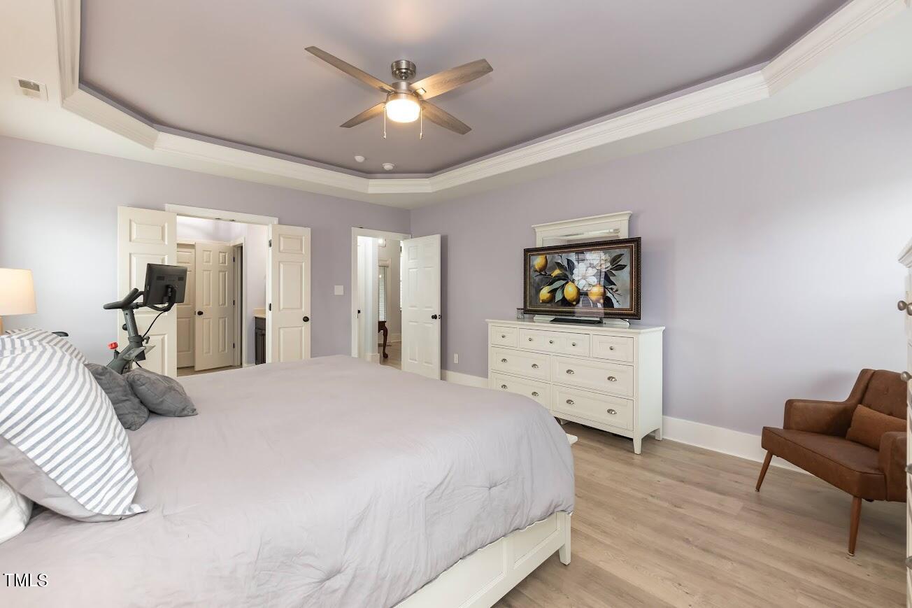 91 Colson Drive Garner, NC 27529 - Photo 26 of 46 a bedroom with a bed a couch and dresser