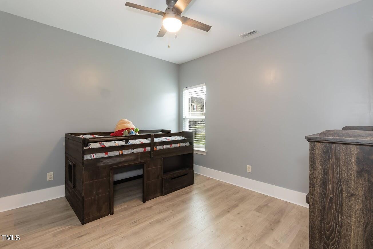 91 Colson Drive Garner, NC 27529 - Photo 29 of 46 a view of kitchen with stove and wooden floor