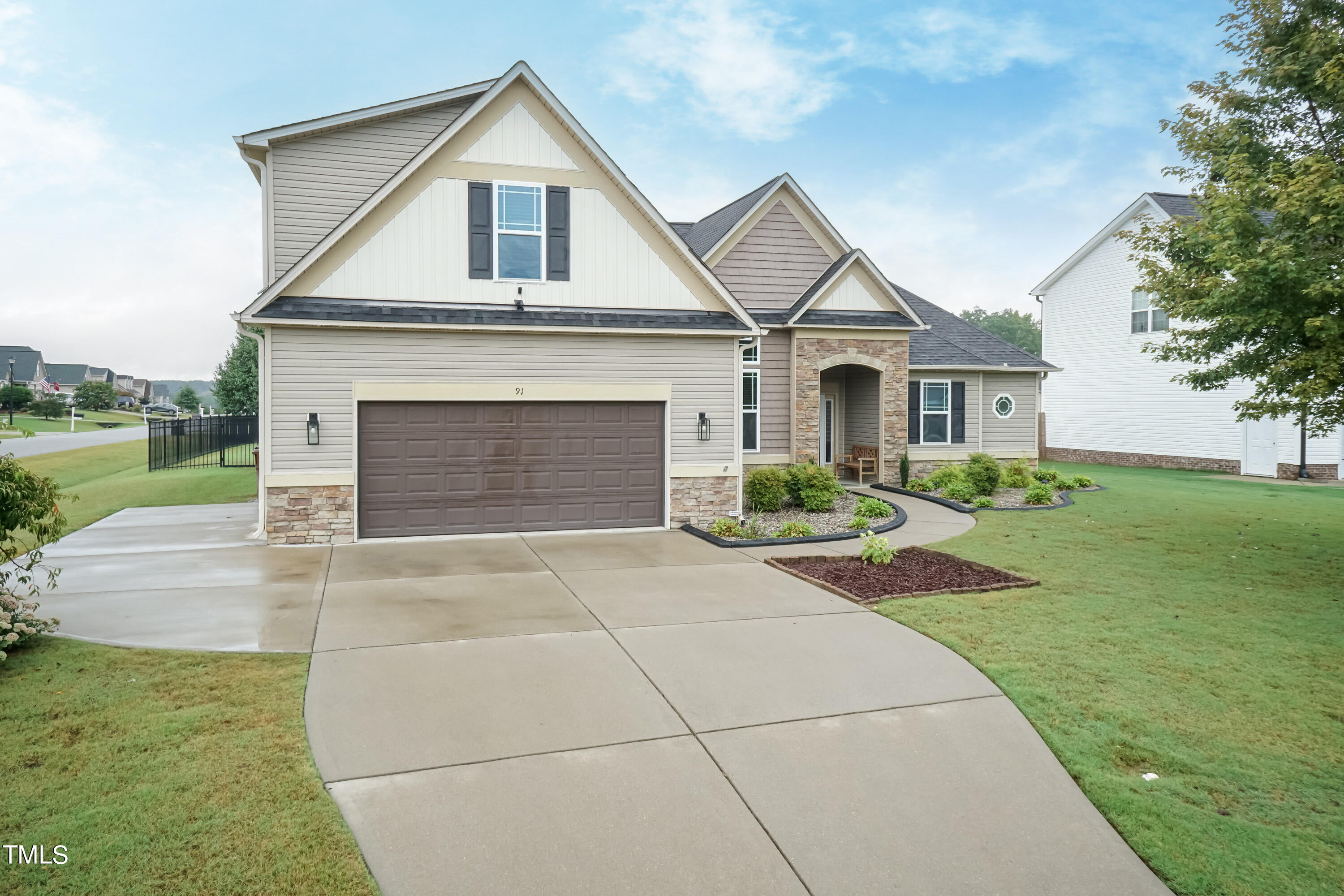 91 Colson Drive Garner, NC 27529 - Photo 3 of 46 a front view of a house with a yard and garage