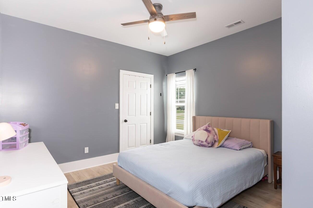 91 Colson Drive Garner, NC 27529 - Photo 31 of 46 a bedroom with a bed and window