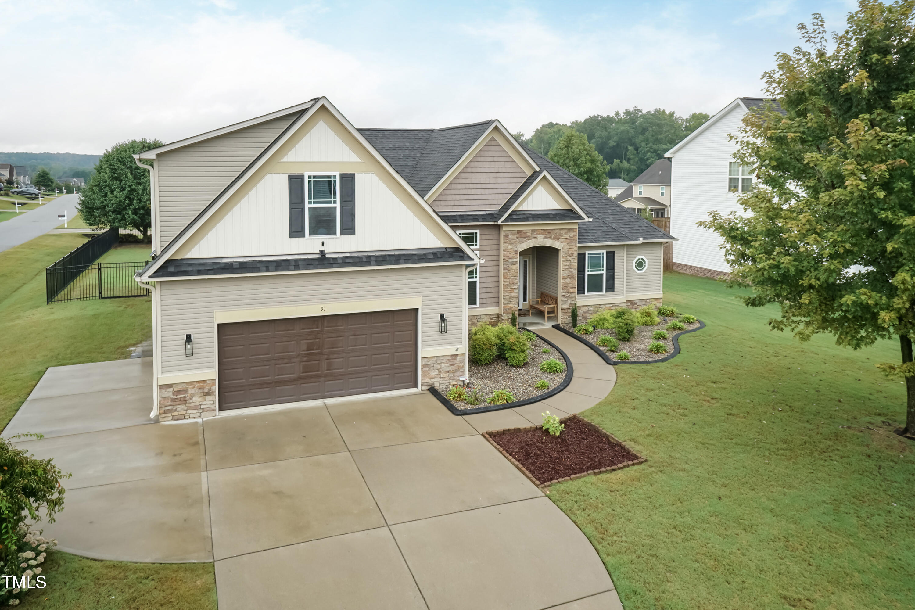 91 Colson Drive Garner, NC 27529 - Photo 4 of 46 a front view of a house with yard and green space