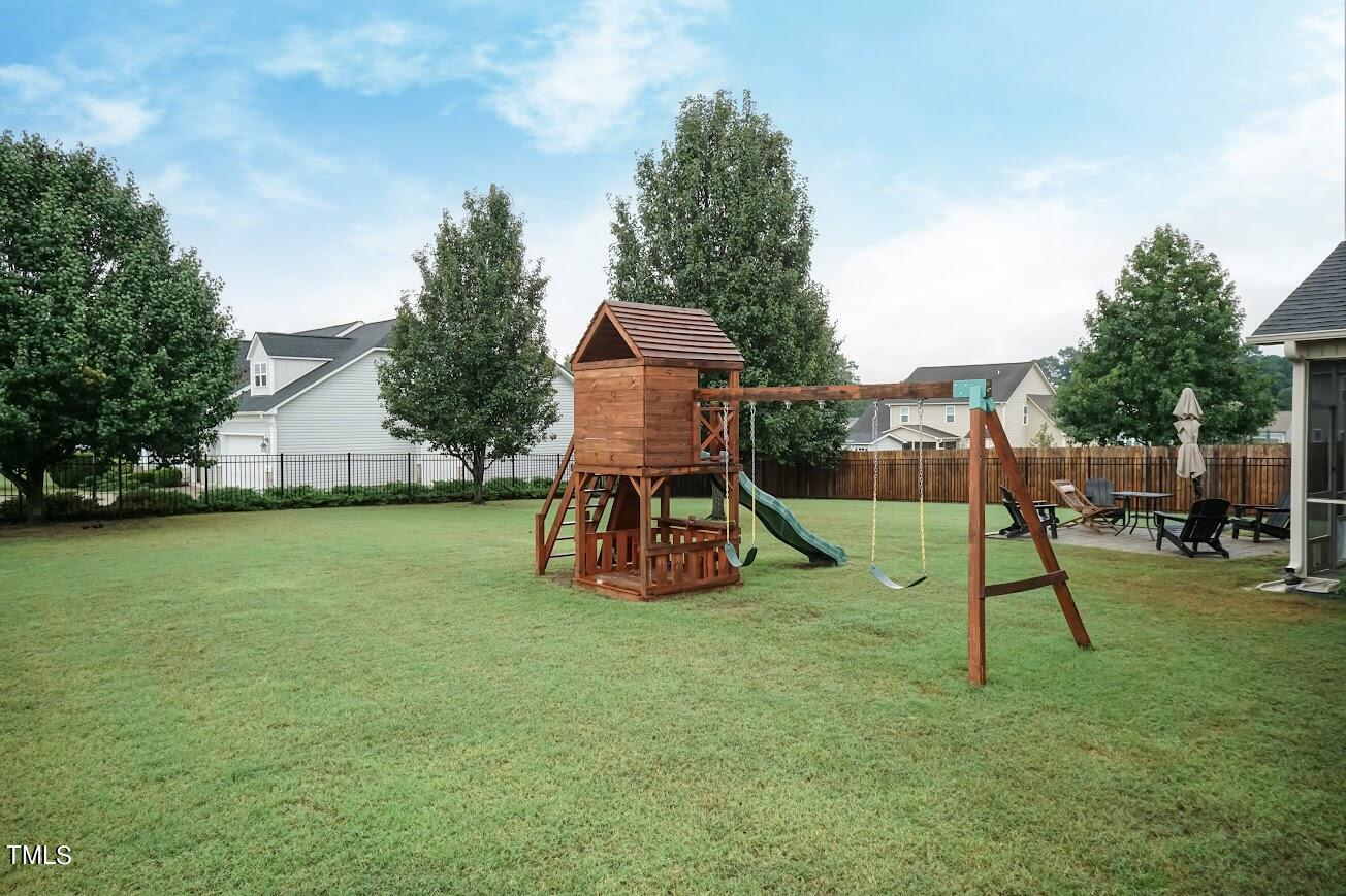 91 Colson Drive Garner, NC 27529 - Photo 43 of 46 a garden view with a slide