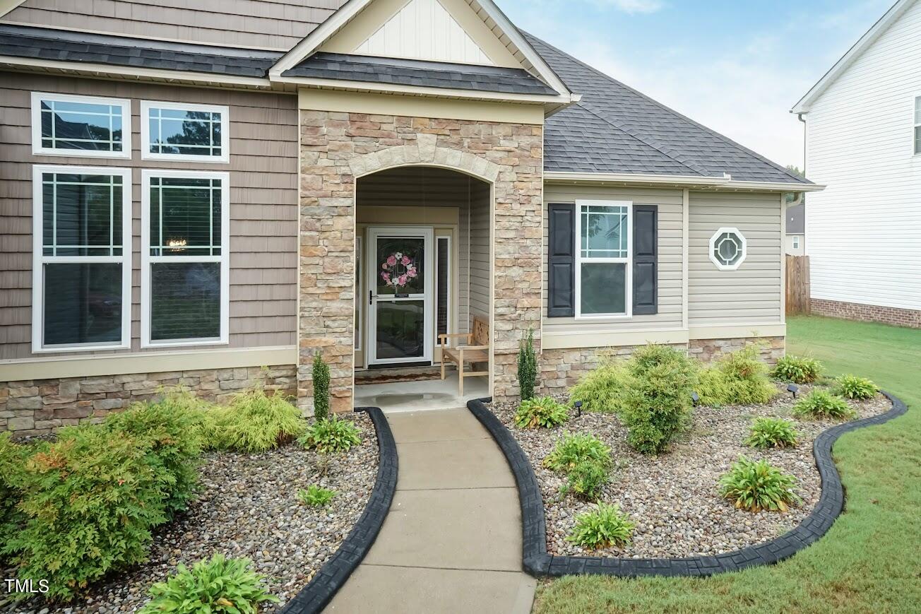 91 Colson Drive Garner, NC 27529 - Photo 7 of 46 a front view of a house with garden