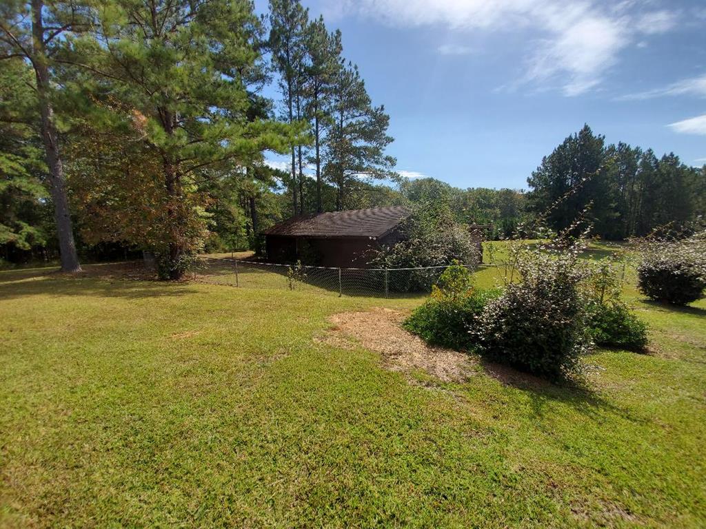 7695 Midland Road Midland, GA 31820 - Photo 48 of 71 Side View of Fenced Barn