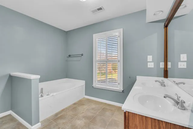 a bathroom with a sink and a bathtub