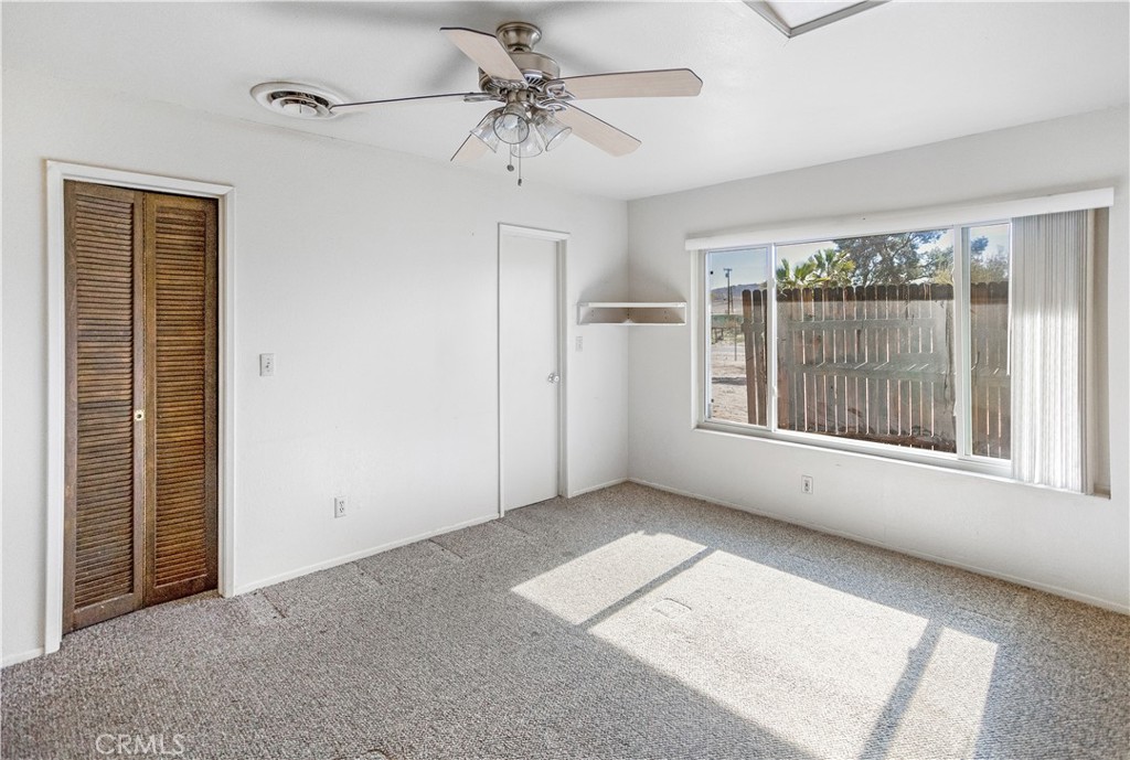 63542 Jadeite Street Joshua Tree, CA 92252 - Photo 26 of 37 a view of an empty room with a window