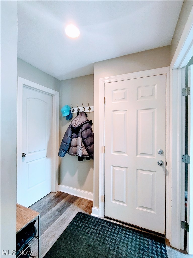 1468 Steese Road Uniontown, OH 44685 - Photo 18 of 28 Mudroom featuring dark hardwood / wood-style floors