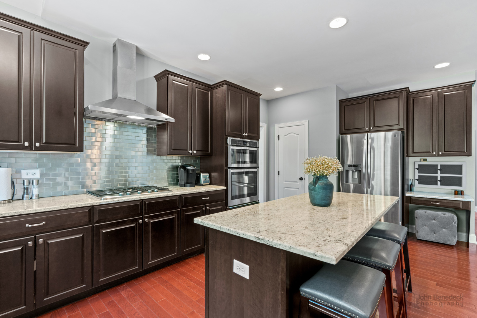 3666 Open Parkway Elgin, IL 60124 - Photo 11 of 40 a kitchen with stainless steel appliances granite countertop a kitchen island hardwood floor sink and stove