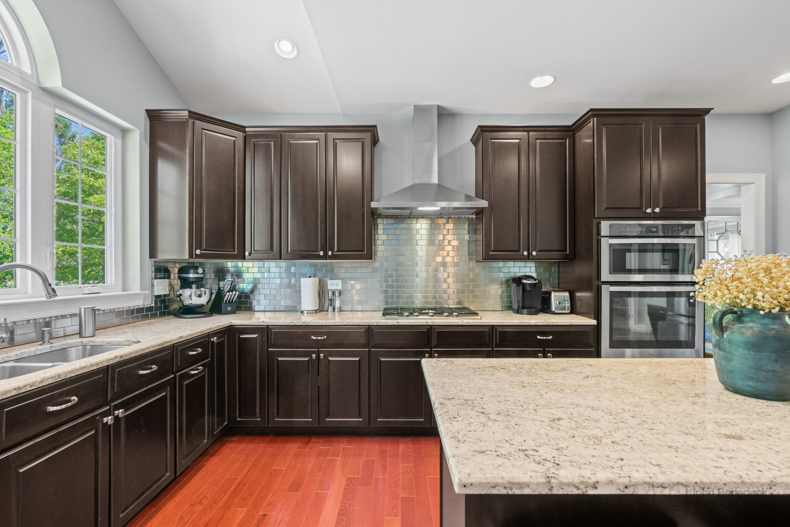3666 Open Parkway Elgin, IL 60124 - Photo 10 of 40 a kitchen with stainless steel appliances granite countertop wooden cabinets a sink a stove a refrigerator and island with wooden floor