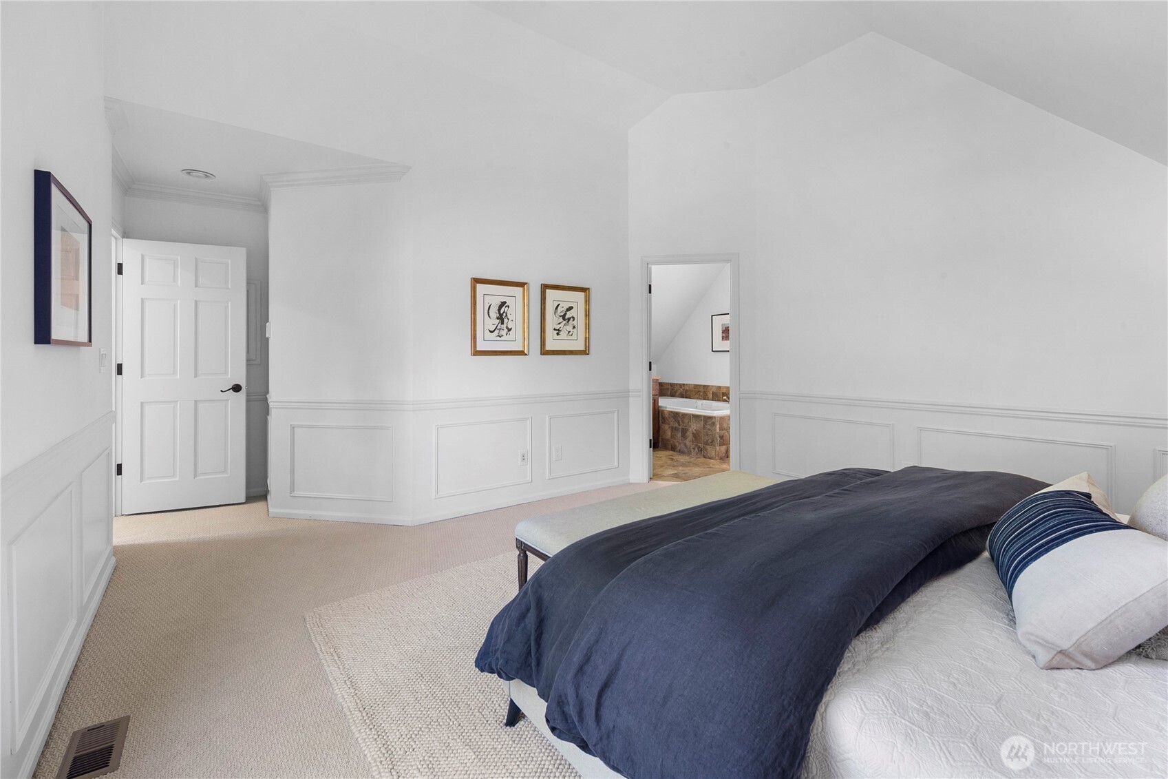 2020 Evergreen Point Road Medina, WA 98039 - Photo 21 of 38 a bedroom with a bed and painting on the wall