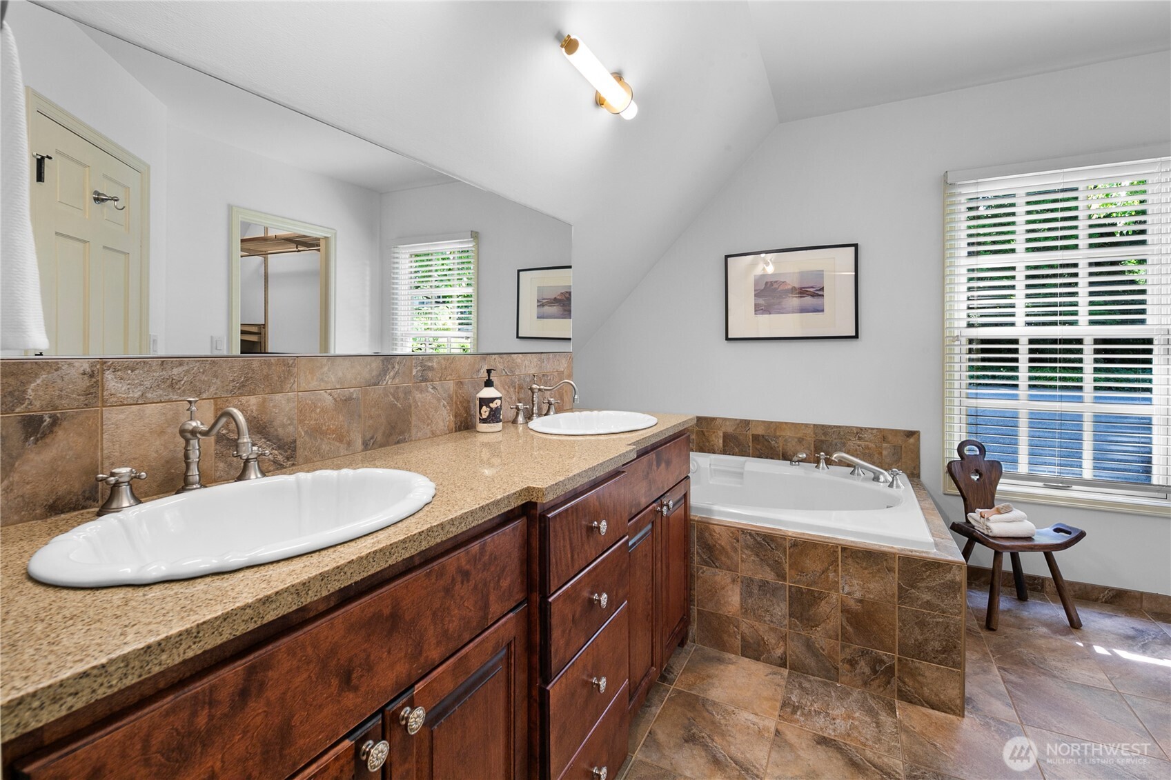 2020 Evergreen Point Road Medina, WA 98039 - Photo 22 of 38 a bathroom with a granite countertop sink and a mirror