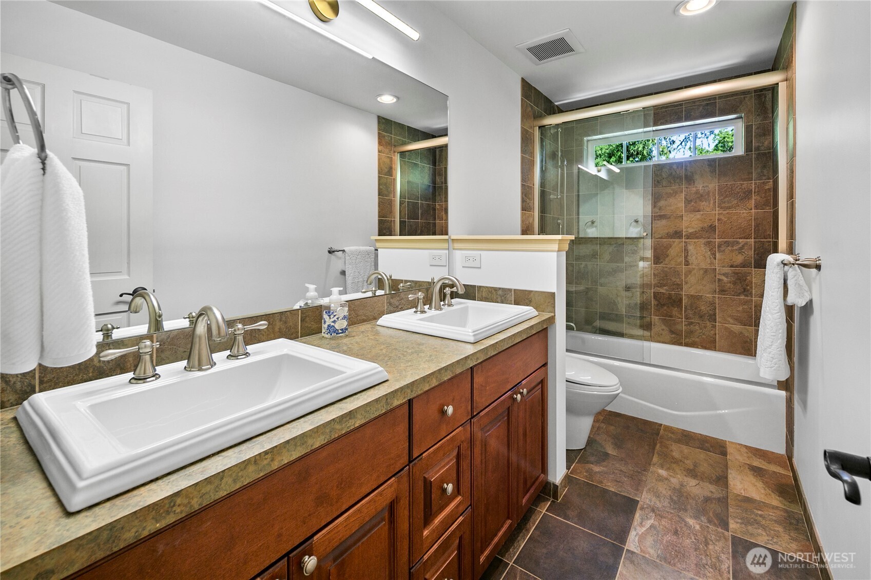 2020 Evergreen Point Road Medina, WA 98039 - Photo 31 of 38 a bathroom with a sink double vanity and a mirror