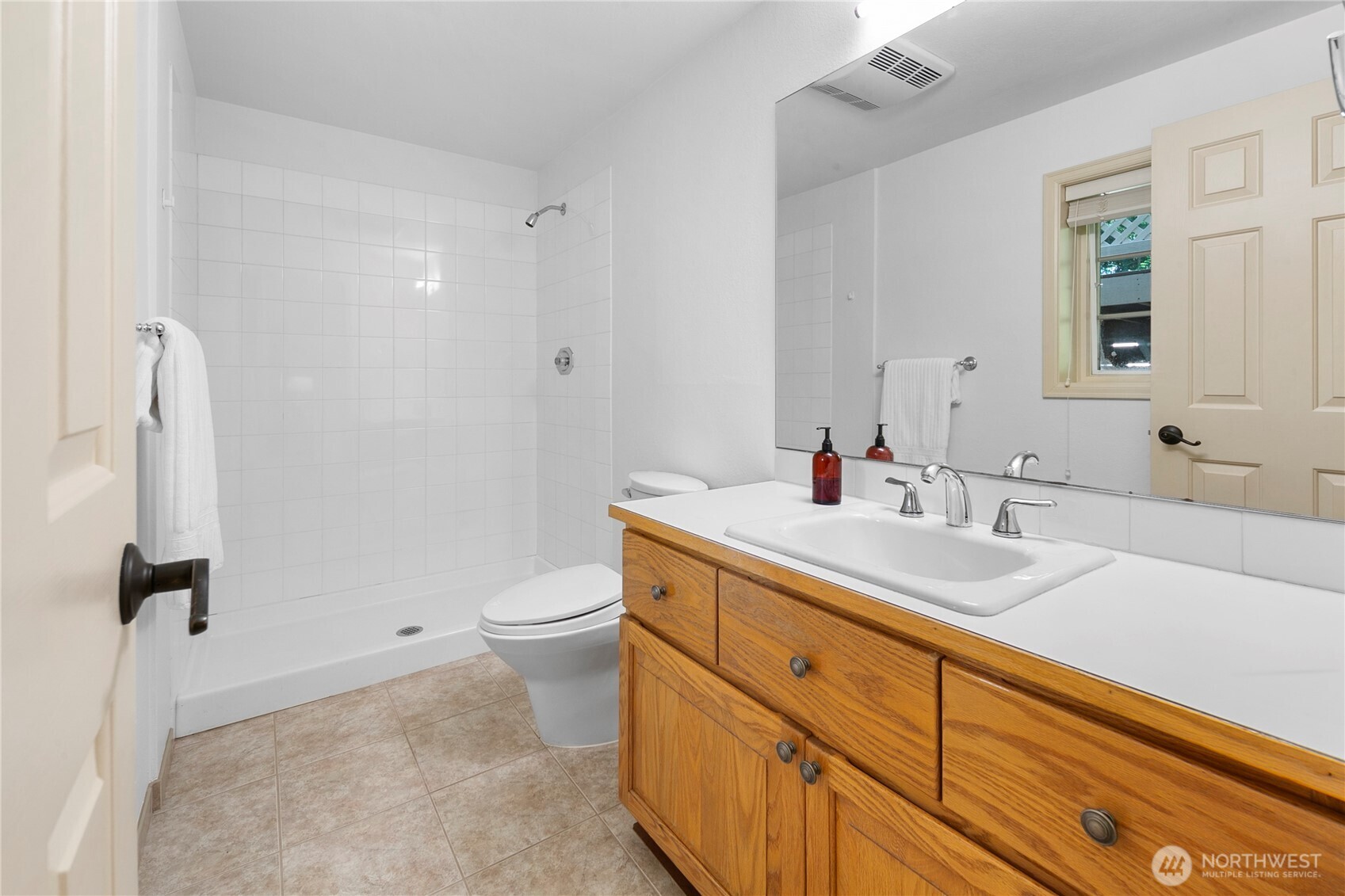 2020 Evergreen Point Road Medina, WA 98039 - Photo 34 of 38 a bathroom with a double vanity sink toilet and a mirror