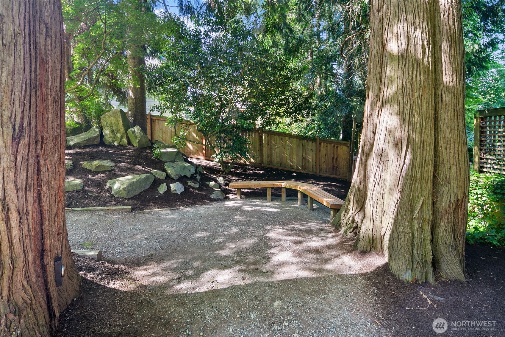 2020 Evergreen Point Road Medina, WA 98039 - Photo 35 of 38 a view of backyard with a table and chairs under an umbrella