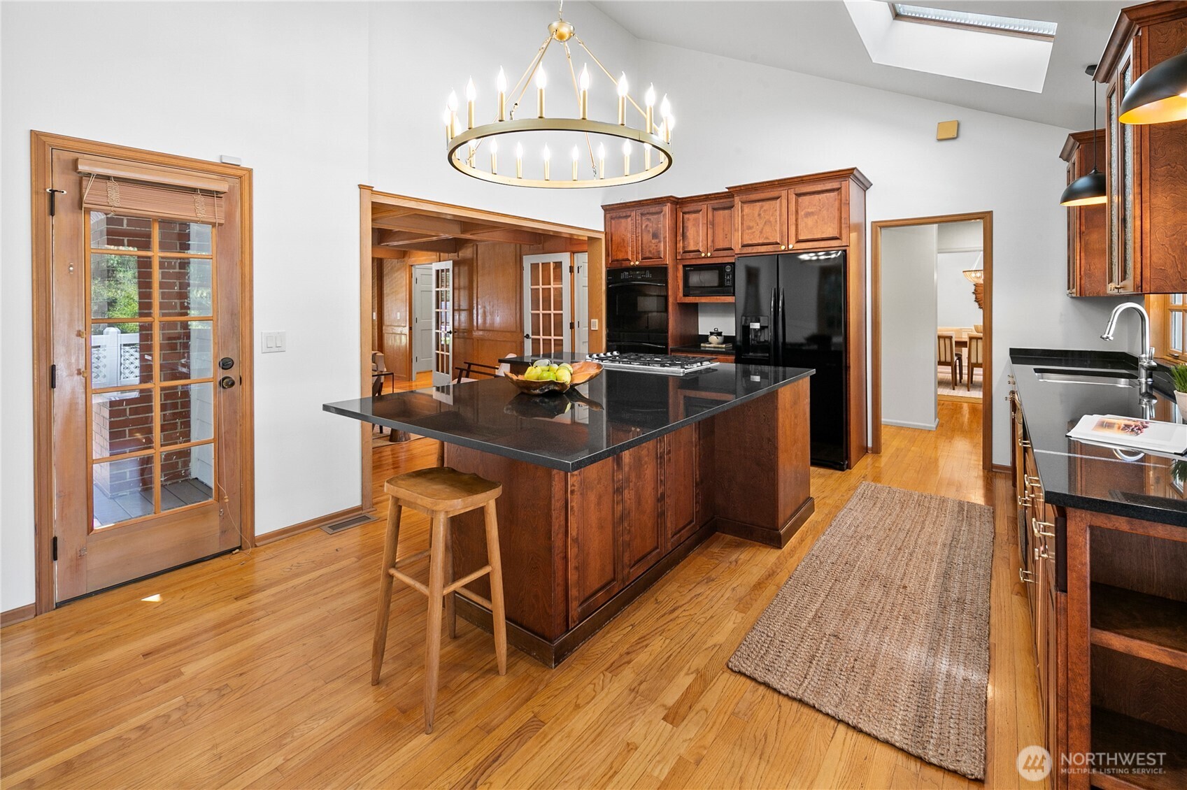 2020 Evergreen Point Road Medina, WA 98039 - Photo 7 of 38 a kitchen with stainless steel appliances granite countertop wooden floors and sink