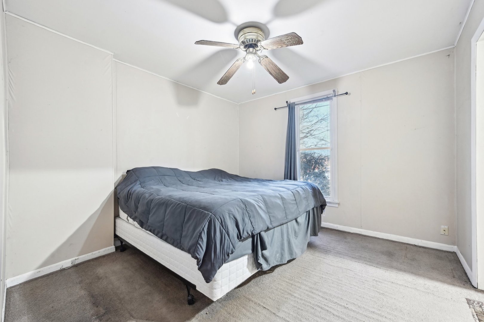 214 South Prospect Street Marengo, IL 60152 - Photo 25 of 37 a spacious bedroom with a bed and a chandelier