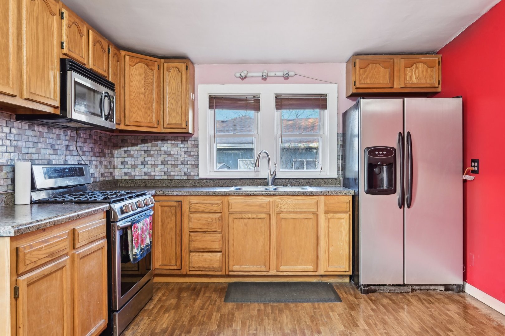 214 South Prospect Street Marengo, IL 60152 - Photo 10 of 37 a kitchen with stainless steel appliances granite countertop a refrigerator and a stove top oven
