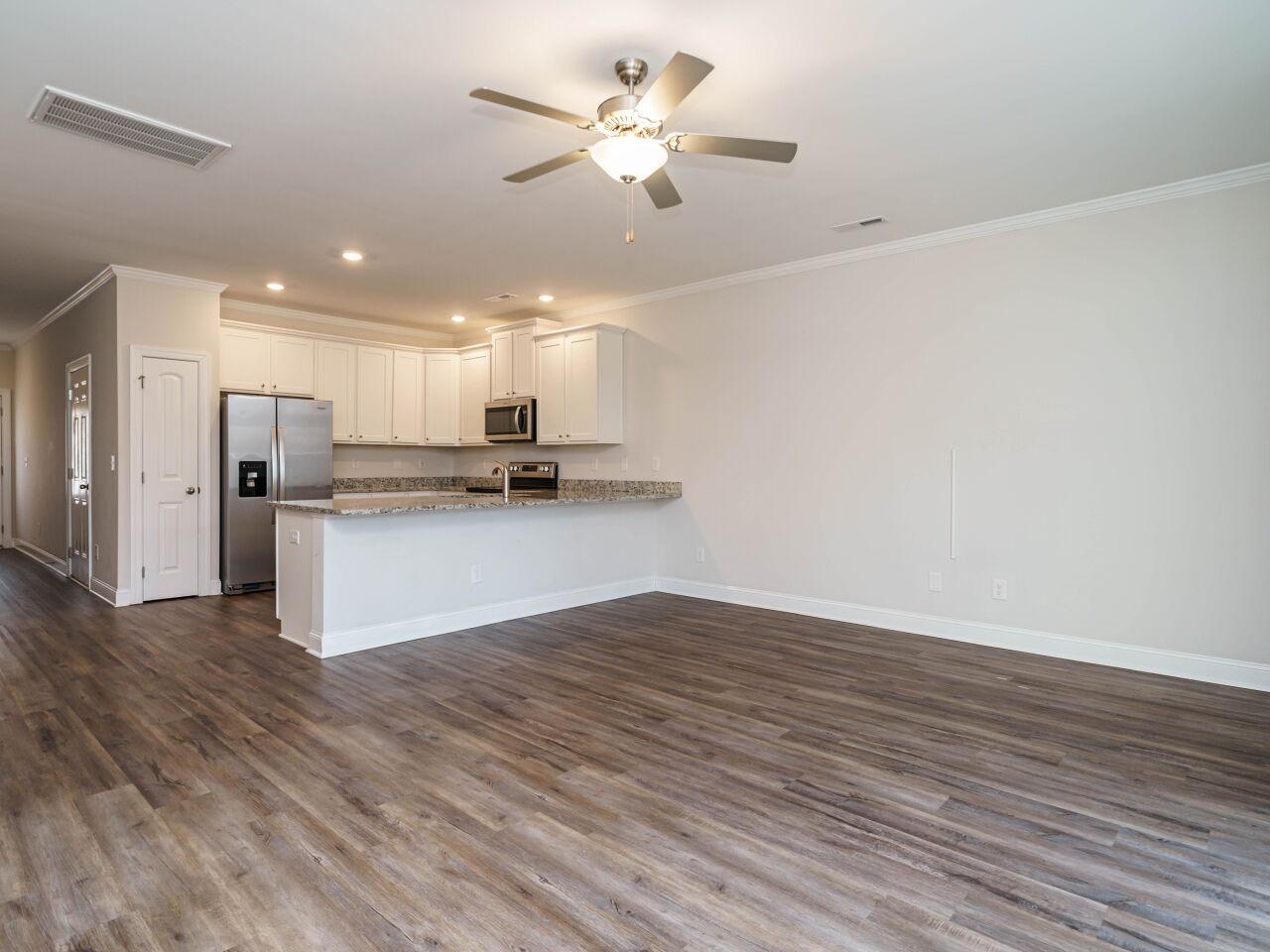 6914 Eddy Point Lane Raleigh, NC 27616 - Photo 11 of 33 a view of kitchen with granite countertop cabinets and refrigerator