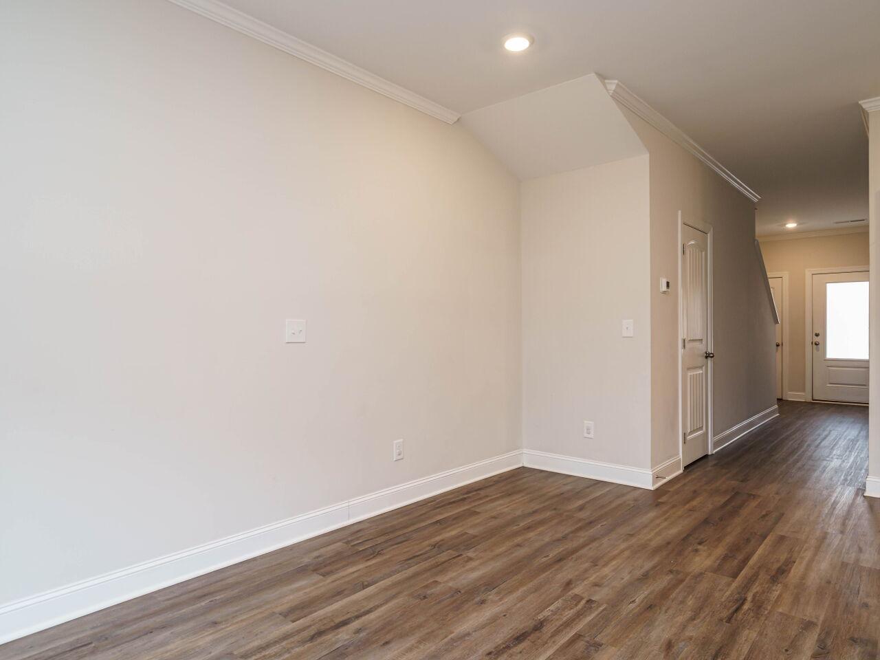 6914 Eddy Point Lane Raleigh, NC 27616 - Photo 13 of 33 a view of an empty room with wooden floor