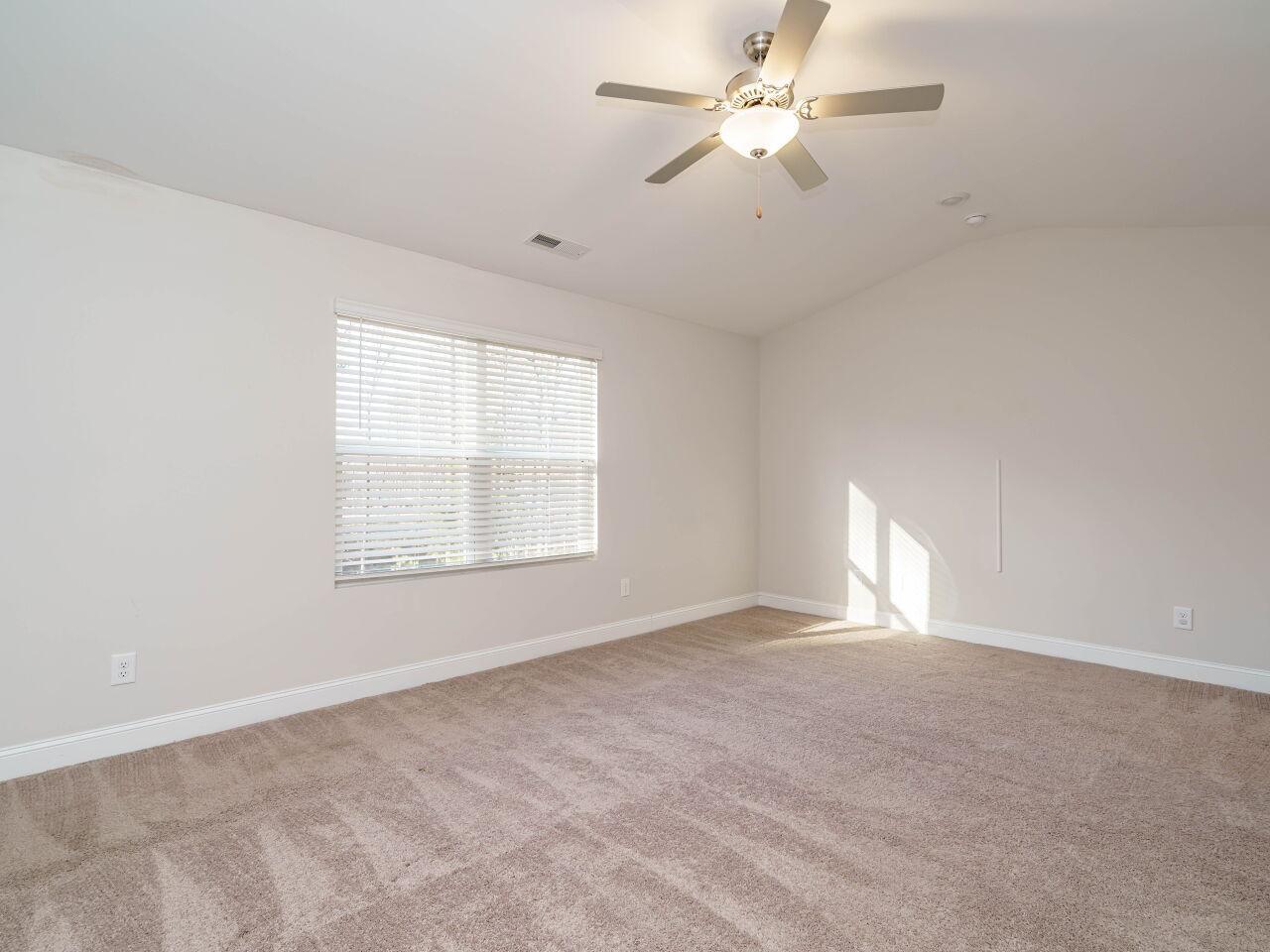 6914 Eddy Point Lane Raleigh, NC 27616 - Photo 18 of 33 a view of an empty room with a window