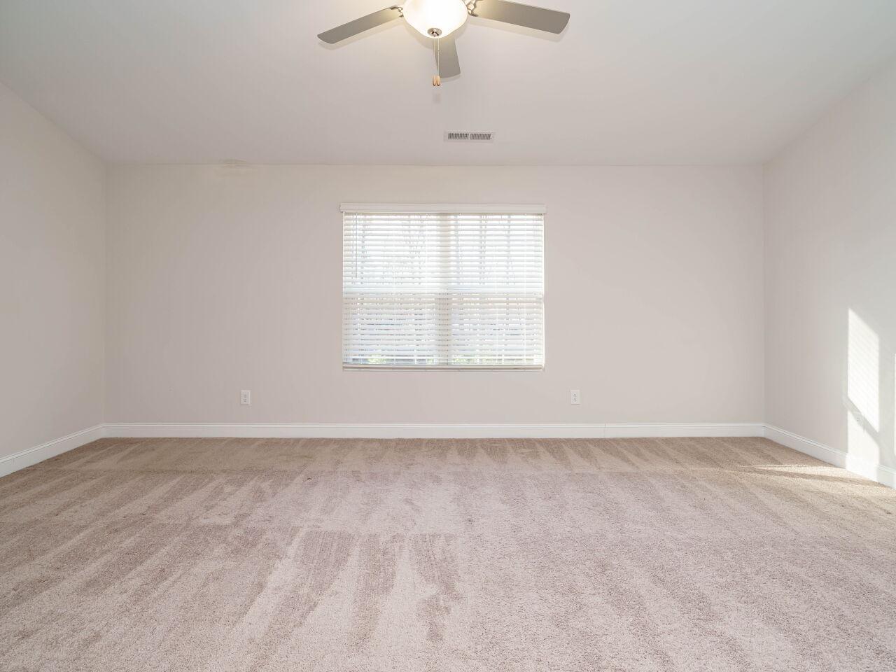 6914 Eddy Point Lane Raleigh, NC 27616 - Photo 19 of 33 an empty room with a window