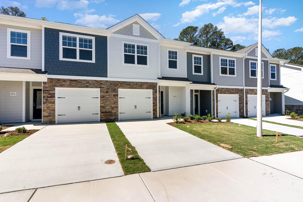 6914 Eddy Point Lane Raleigh, NC 27616 - Photo 2 of 33 a front view of a house with a yard