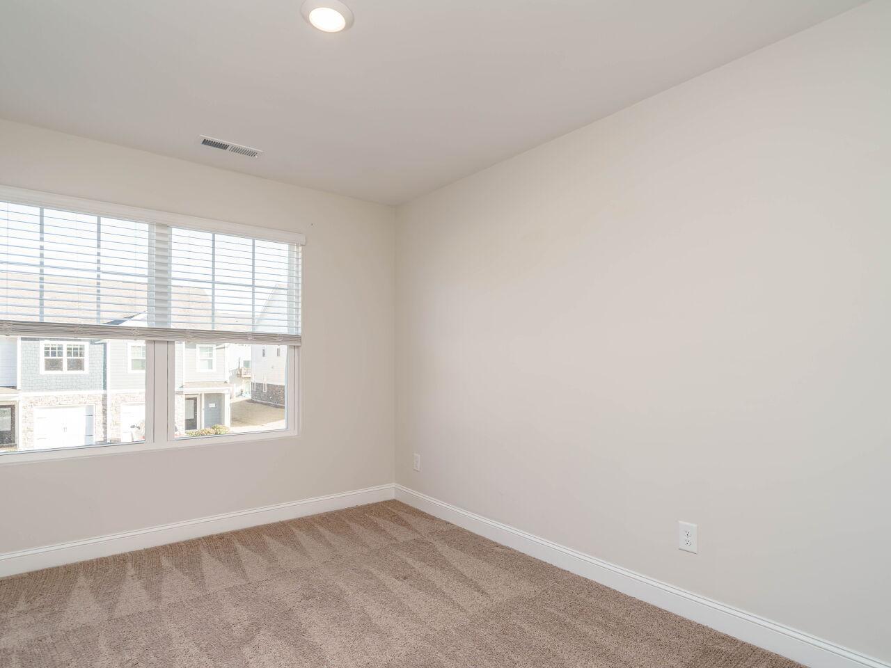 6914 Eddy Point Lane Raleigh, NC 27616 - Photo 24 of 33 an empty room with a window