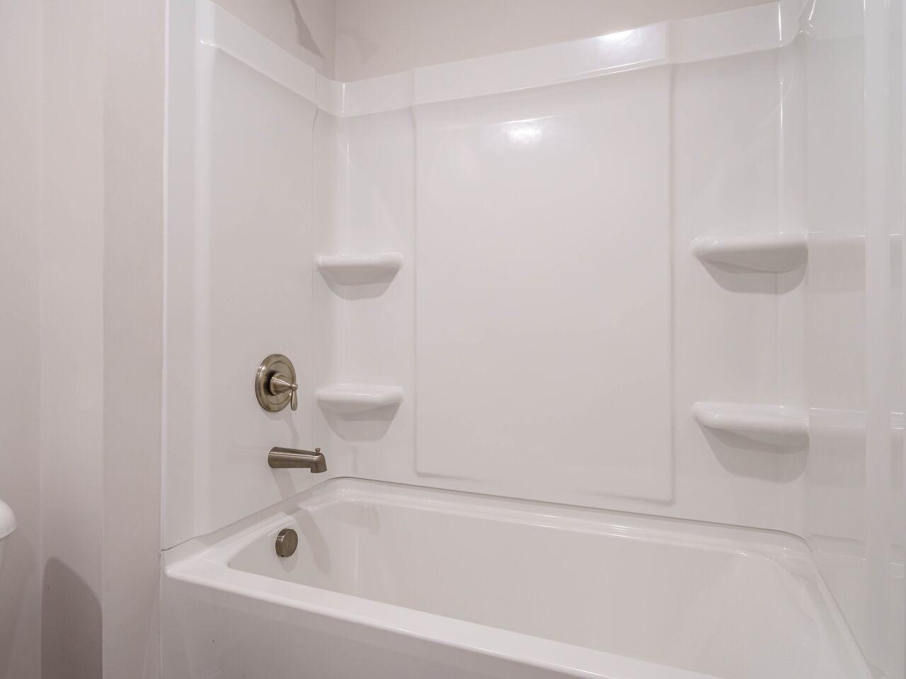 6914 Eddy Point Lane Raleigh, NC 27616 - Photo 26 of 33 a bathroom with a bathtub