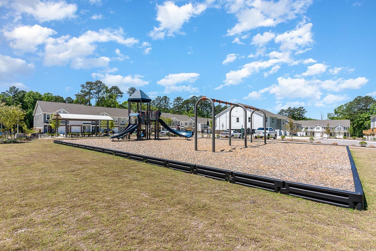 6914 Eddy Point Lane Raleigh, NC 27616 - Photo 32 of 33 a view of swimming pool with lawn chairs and large tree
