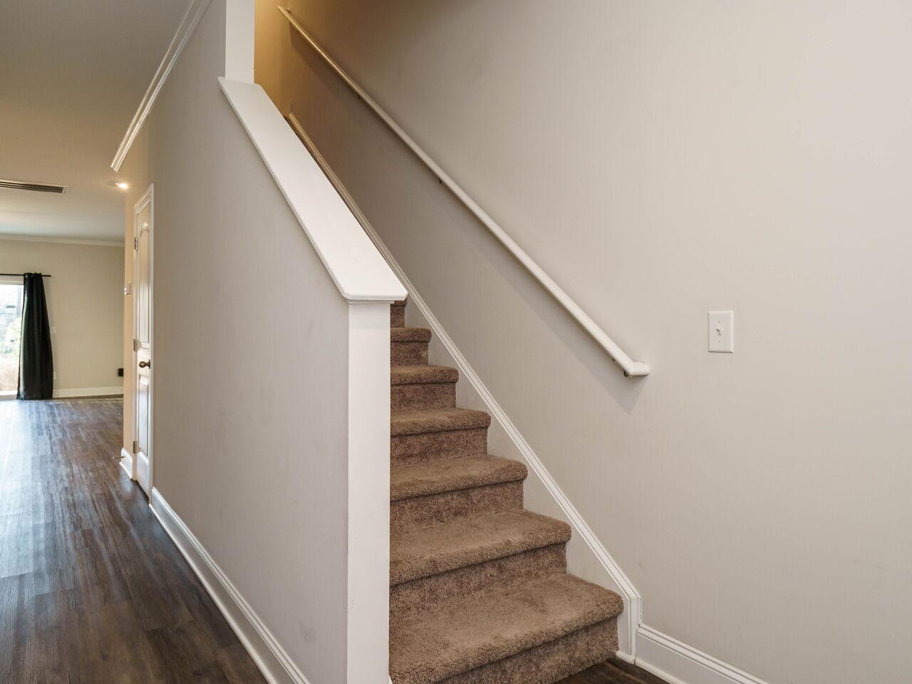 6914 Eddy Point Lane Raleigh, NC 27616 - Photo 6 of 33 a view of entryway and hall with wooden floor