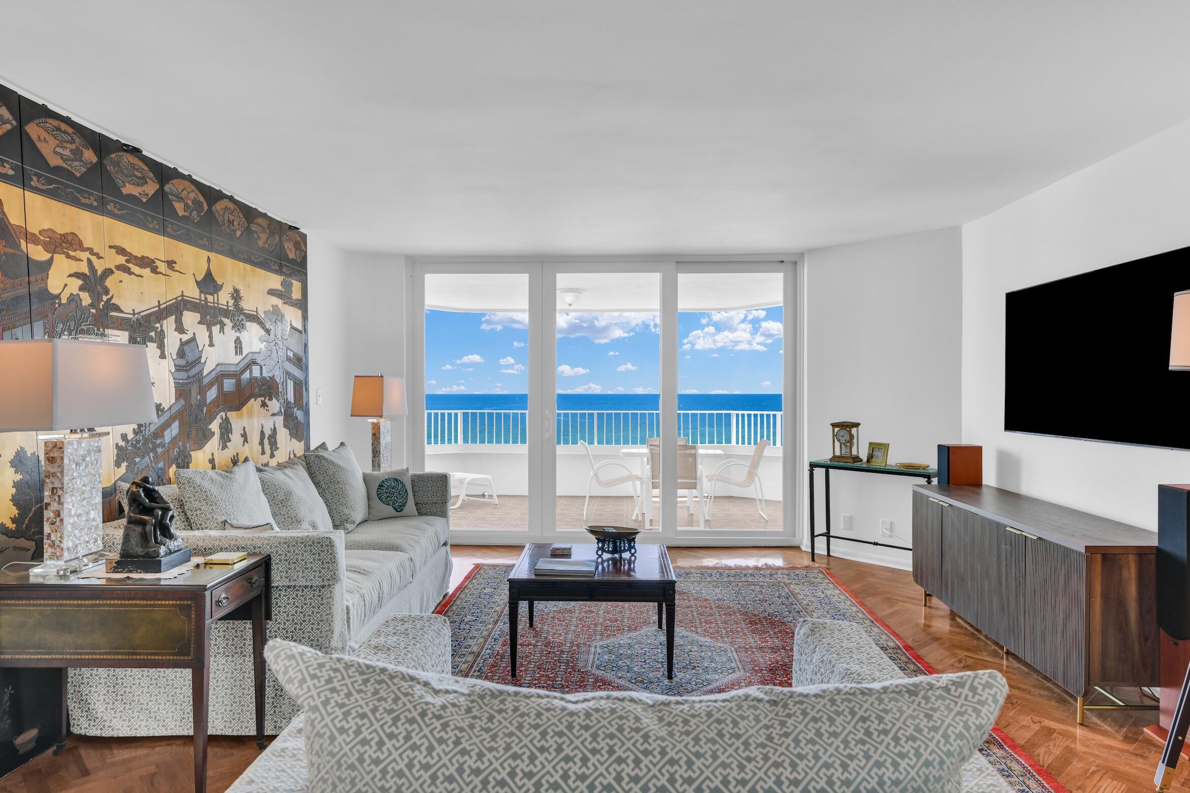 500 South Ocean Boulevard, Unit 1006 Boca Raton, FL 33432 - Photo 1 of 40 a living room with furniture and a flat screen tv
